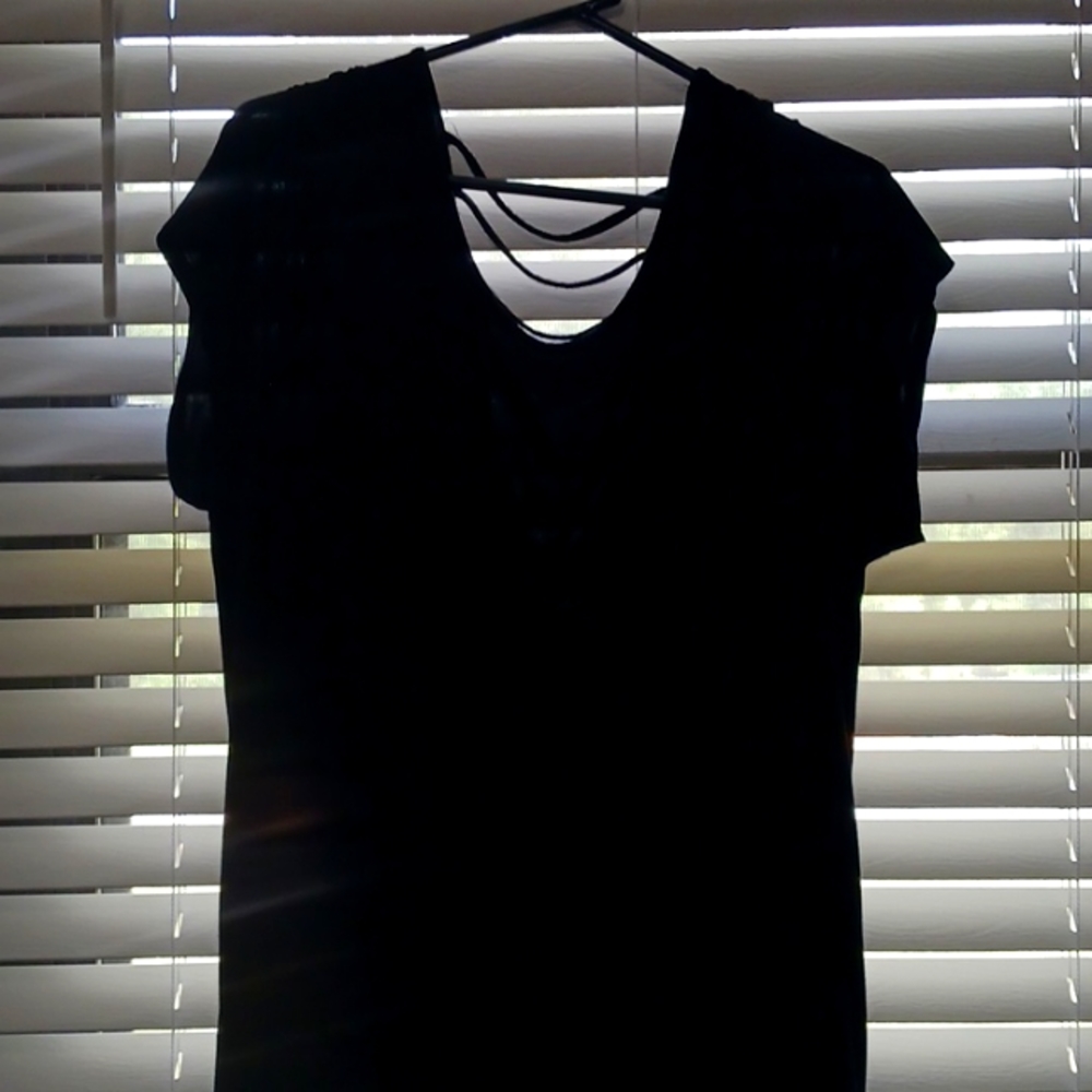 Torrid Black Flowy top with drape ( string drape) in back.